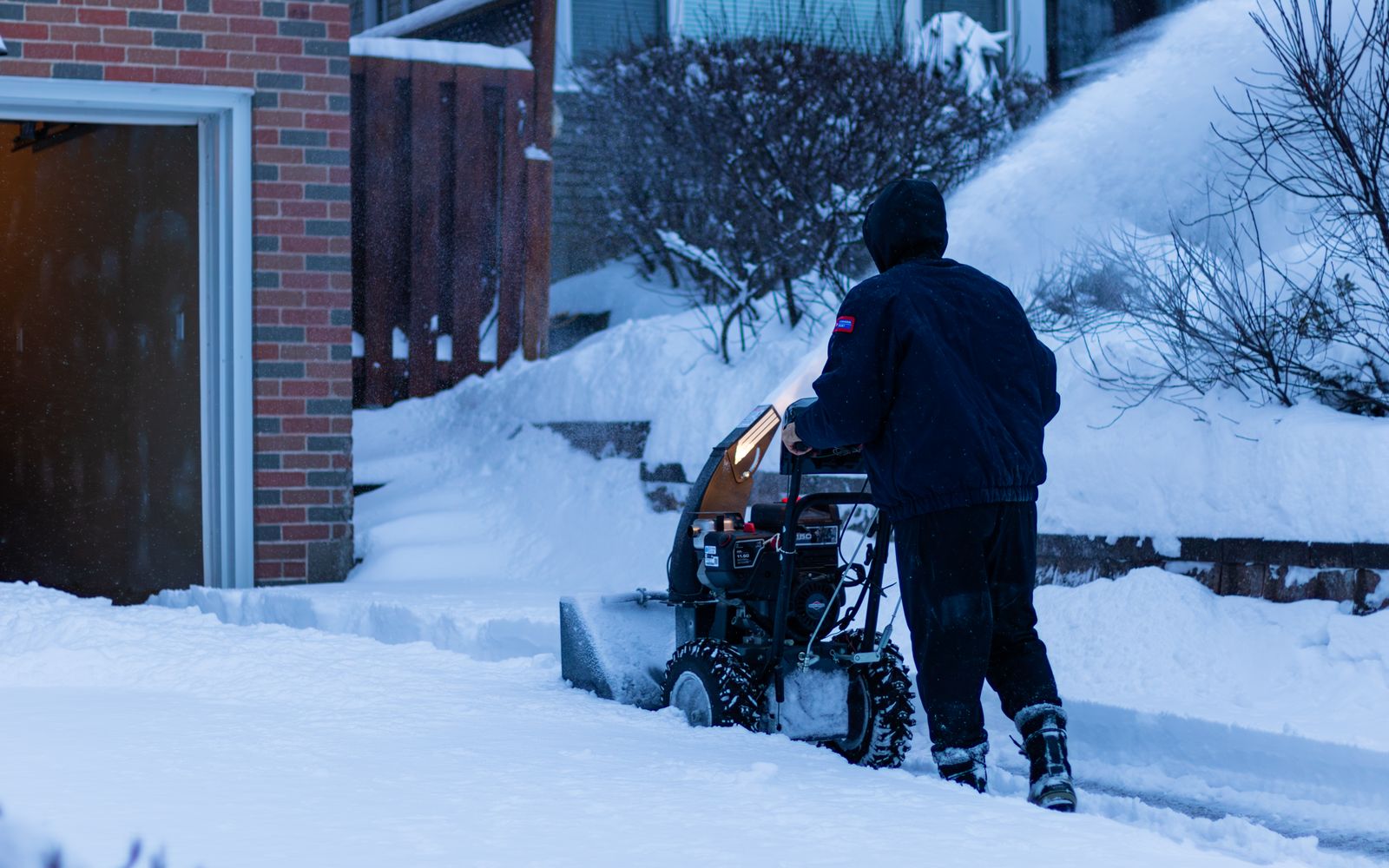 Crew clearing a snowy walkway