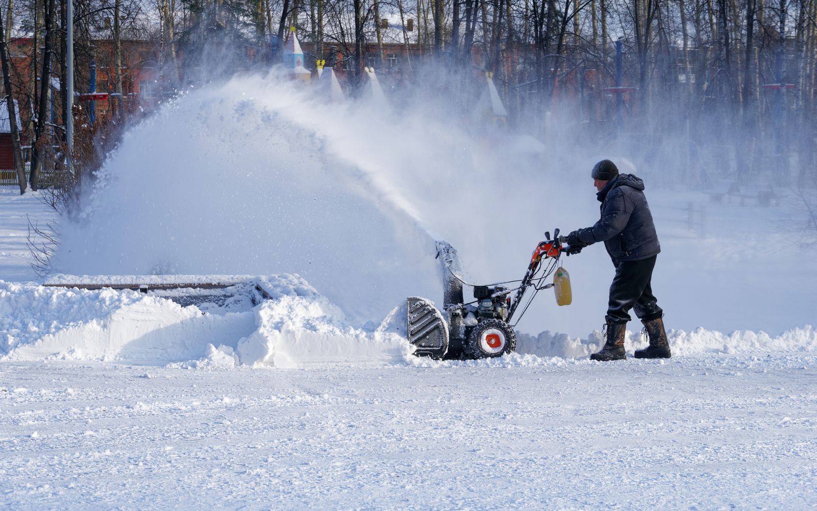 Snow blower clearing a path